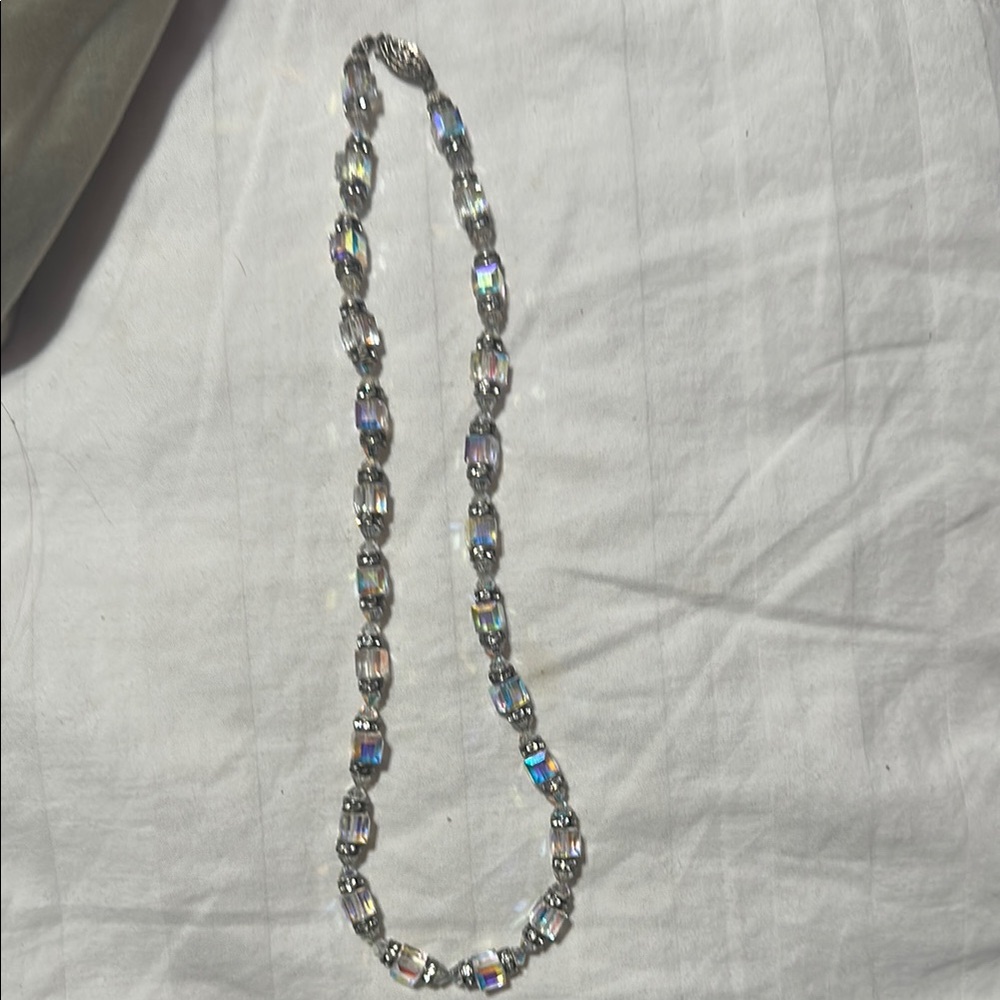 Elegant Silver Necklace with Interconnected Links and Light Blue Accent